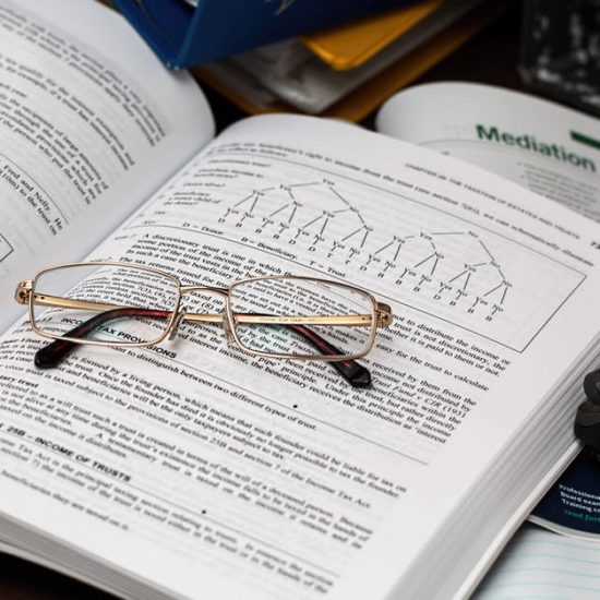 Image of Textbook and glasses